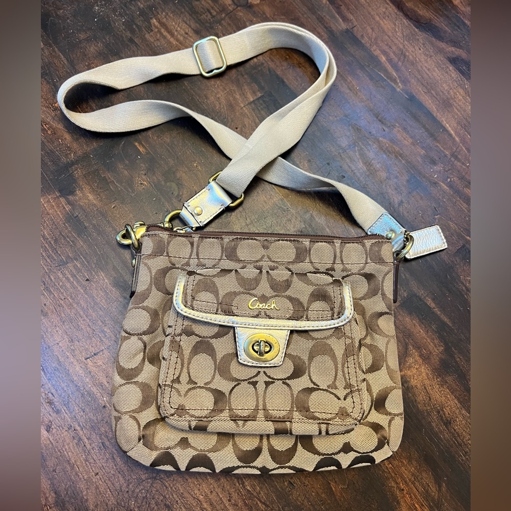 Coach small logo purse with gold trim. Adjustable strap